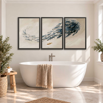A sweeping school of small gray fish curving across a pale neutral background 3 piece framed canvas wall art styled in an interior