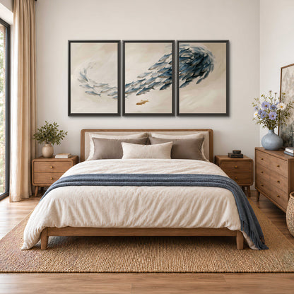 A sweeping school of small gray fish curving across a pale neutral background 3 piece framed canvas wall art styled in an interior