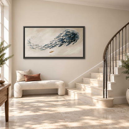 A sweeping school of small gray fish curving across a pale neutral background single framed canvas wall art styled in an interior