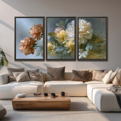 Cream, blush and rust-colored garden flowers gathered against a muted blue-gray background 3 piece framed canvas wall art displayed in a living room