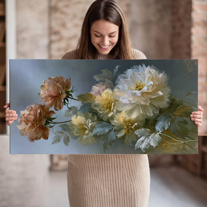 Cream, blush and rust-colored garden flowers gathered against a muted blue-gray background single canvas wall art held in hands