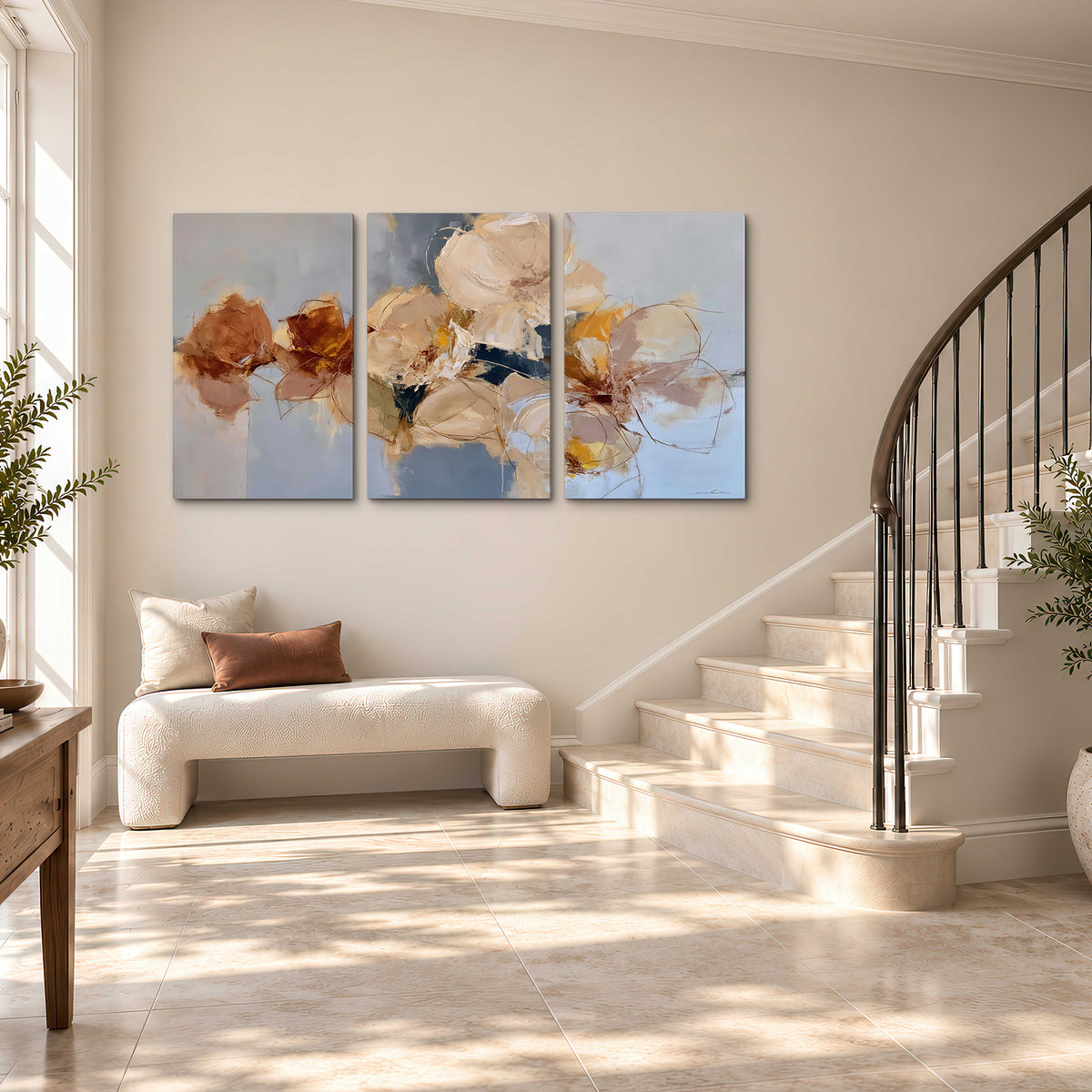 Loose ivory and ochre flower forms layered over a pale blue painterly background 3 piece canvas wall art styled in an interior