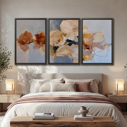 Loose ivory and ochre flower forms layered over a pale blue painterly background 3 piece framed canvas wall art displayed in a bedroom