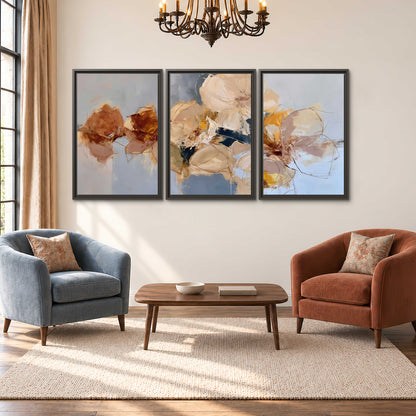 Loose ivory and ochre flower forms layered over a pale blue painterly background 3 piece framed canvas wall art styled in an interior