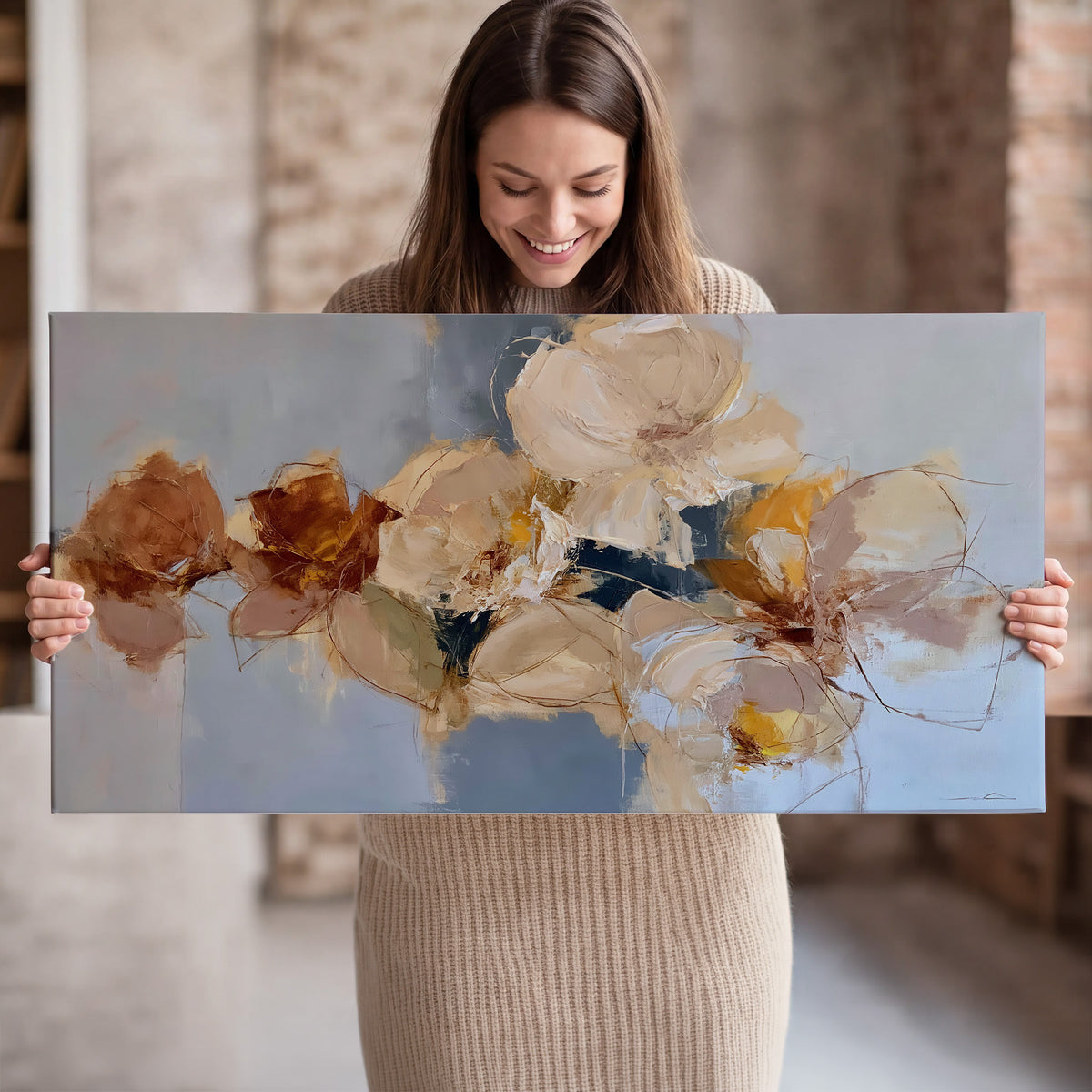 Loose ivory and ochre flower forms layered over a pale blue painterly background single canvas wall art held in hands