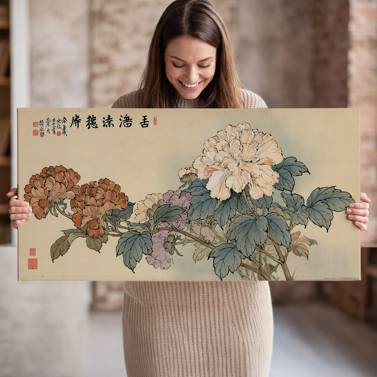 Pale pink peonies and green leaves on a warm beige background with decorative script single canvas wall art held in hands