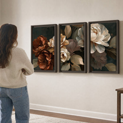 Large ivory roses and warm rust blooms against a deep shadowed background 3 piece framed canvas wall art three panel arrangement on a wall