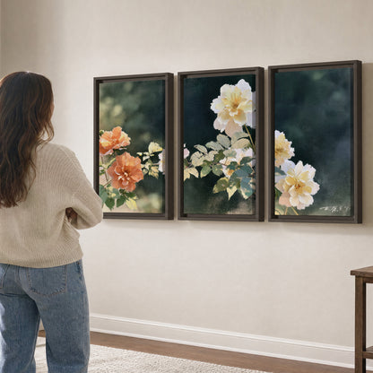 White and peach roses with green leaves against a deep blue-green background 3 piece framed canvas wall art three panel arrangement on a wall