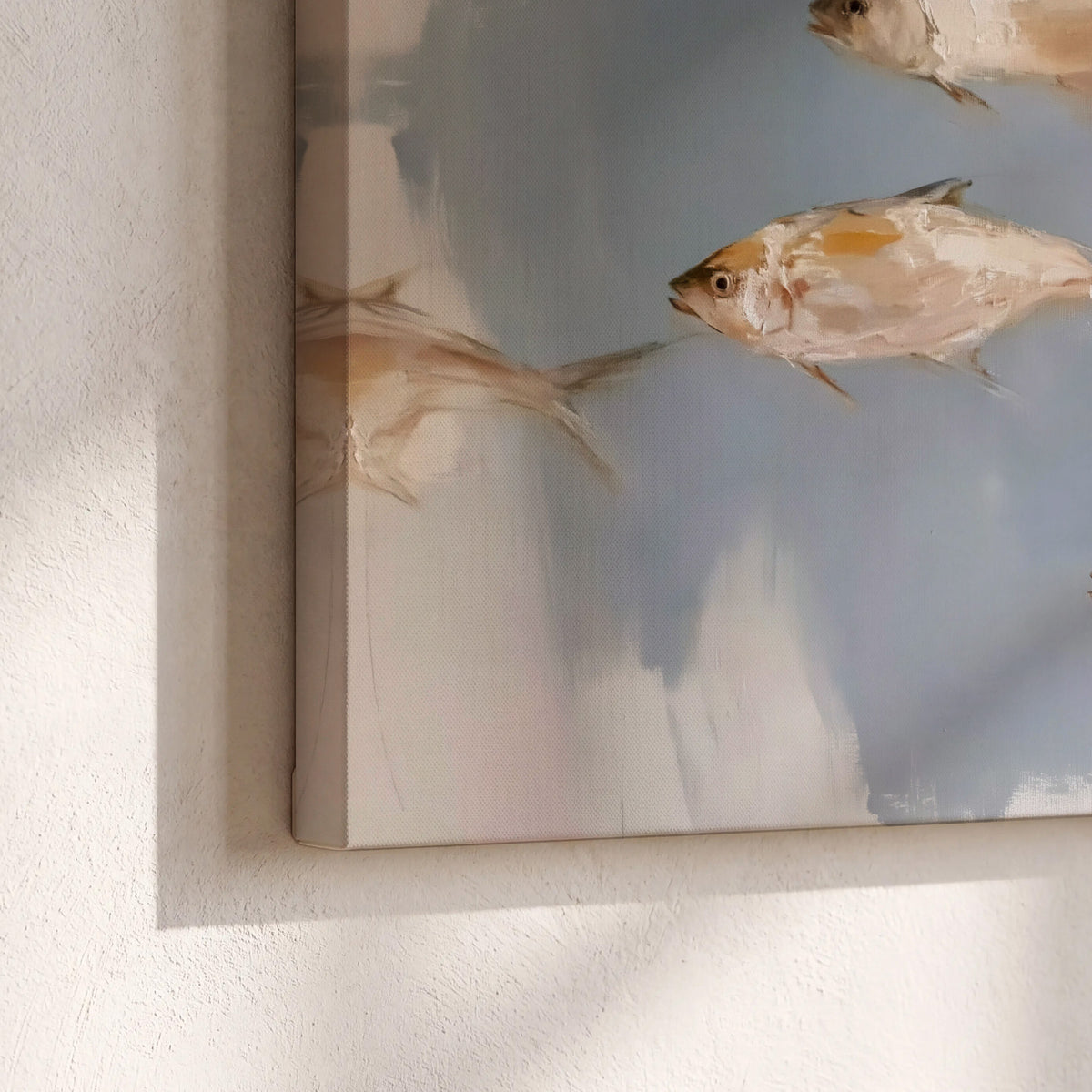Small blue and golden fish moving across a pale layered abstract background 3 piece canvas wall art material and edge close up