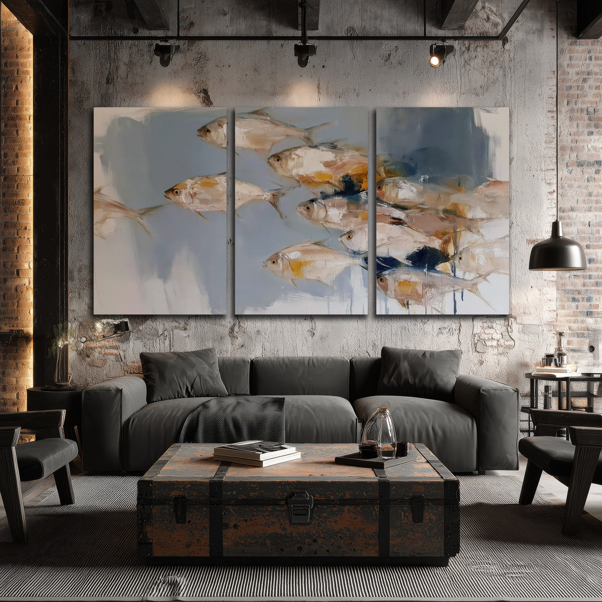 Small blue and golden fish moving across a pale layered abstract background 3 piece canvas wall art displayed in a industrial room
