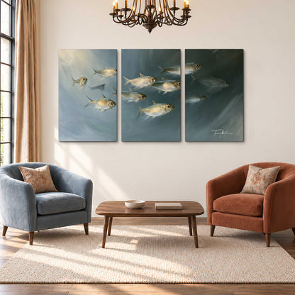 A small school of pale golden fish swimming across dark blue-green water 3 piece canvas wall art styled in an interior