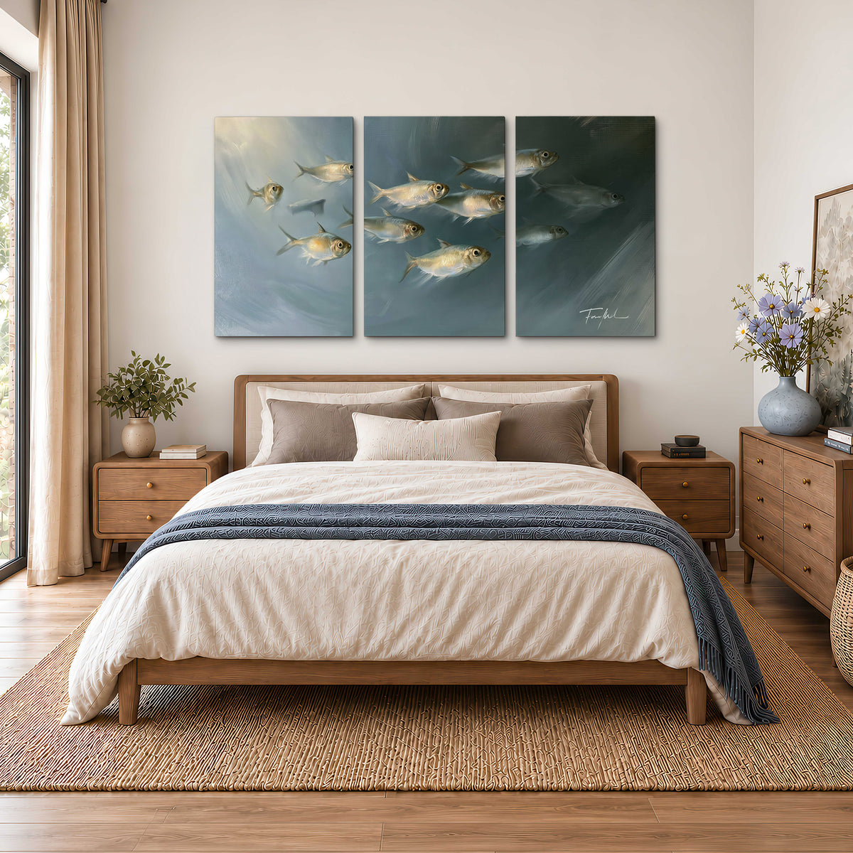 A small school of pale golden fish swimming across dark blue-green water 3 piece canvas wall art styled in an interior