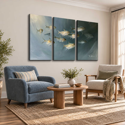 A small school of pale golden fish swimming across dark blue-green water 3 piece canvas wall art styled in an interior