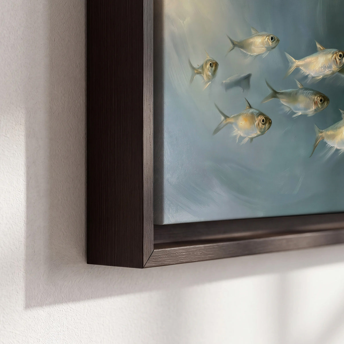 A small school of pale golden fish swimming across dark blue-green water 3 piece framed canvas wall art material and edge close up