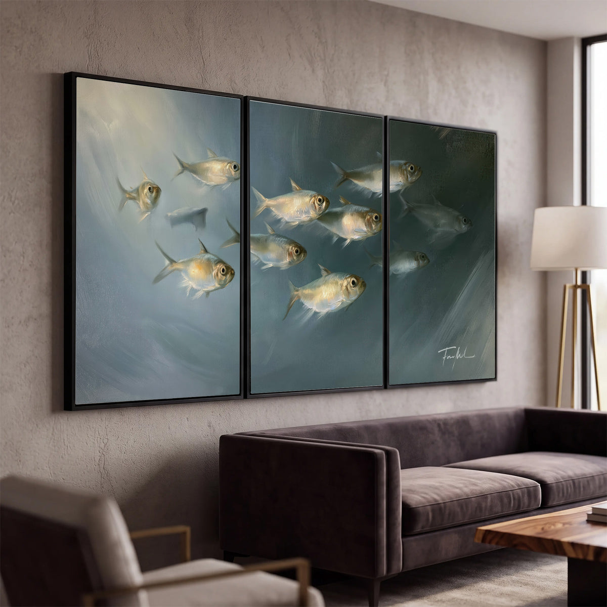 A small school of pale golden fish swimming across dark blue-green water 3 piece framed canvas wall art displayed in a modern living room