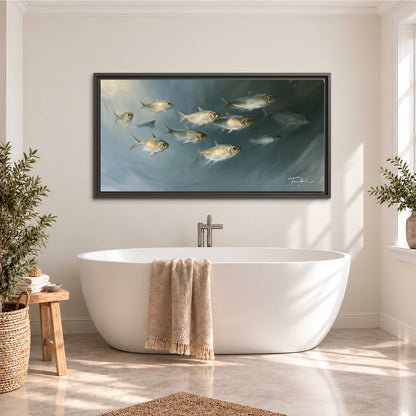 A small school of pale golden fish swimming across dark blue-green water single framed canvas wall art styled in an interior