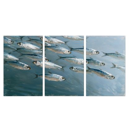 A school of silver fish moving together through cool blue water 3 piece canvas wall art viewed straight on