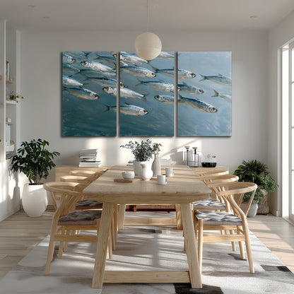 A school of silver fish moving together through cool blue water 3 piece canvas wall art room and product view