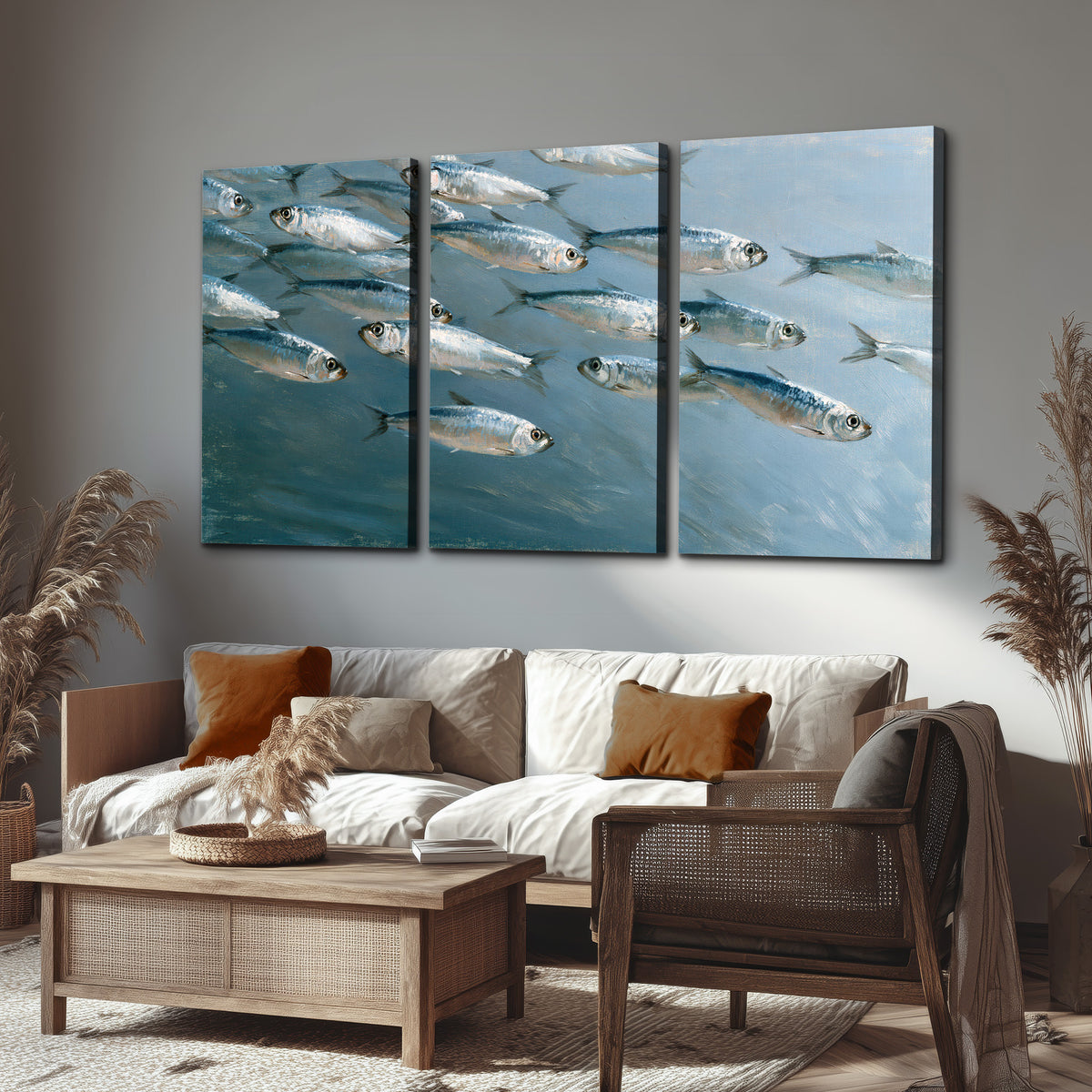 A school of silver fish moving together through cool blue water 3 piece canvas wall art displayed in a rustic living room