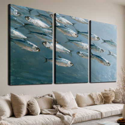 A school of silver fish moving together through cool blue water 3 piece canvas wall art room and product view
