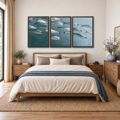 A school of silver fish moving together through cool blue water 3 piece framed canvas wall art styled in an interior