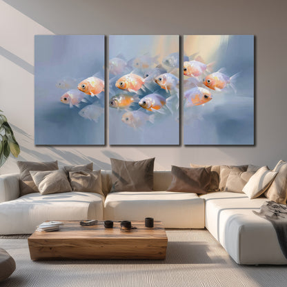 Rounded peach and gold fish floating in a softly lit blue underwater scene 3 piece canvas wall art displayed in a living room