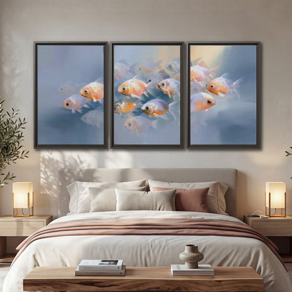 Rounded peach and gold fish floating in a softly lit blue underwater scene 3 piece framed canvas wall art displayed in a bedroom