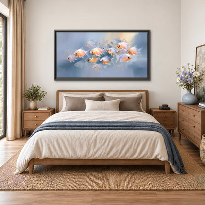 Rounded peach and gold fish floating in a softly lit blue underwater scene single framed canvas wall art styled in an interior