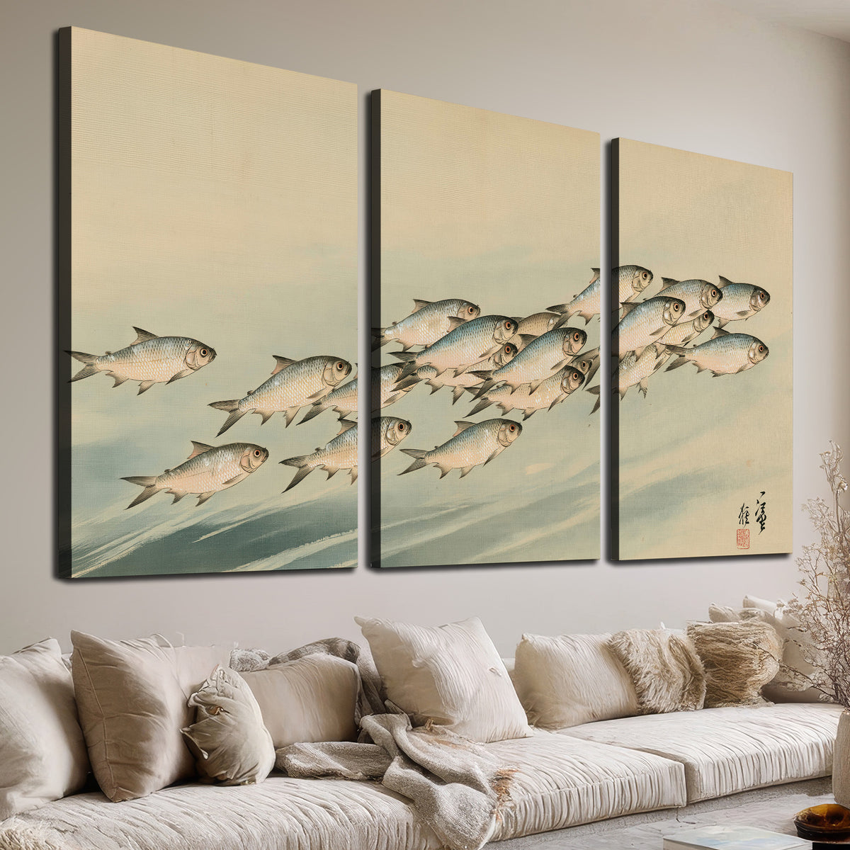 A flowing school of small fish above pale blue water on a cream ground 3 piece canvas wall art room and product view