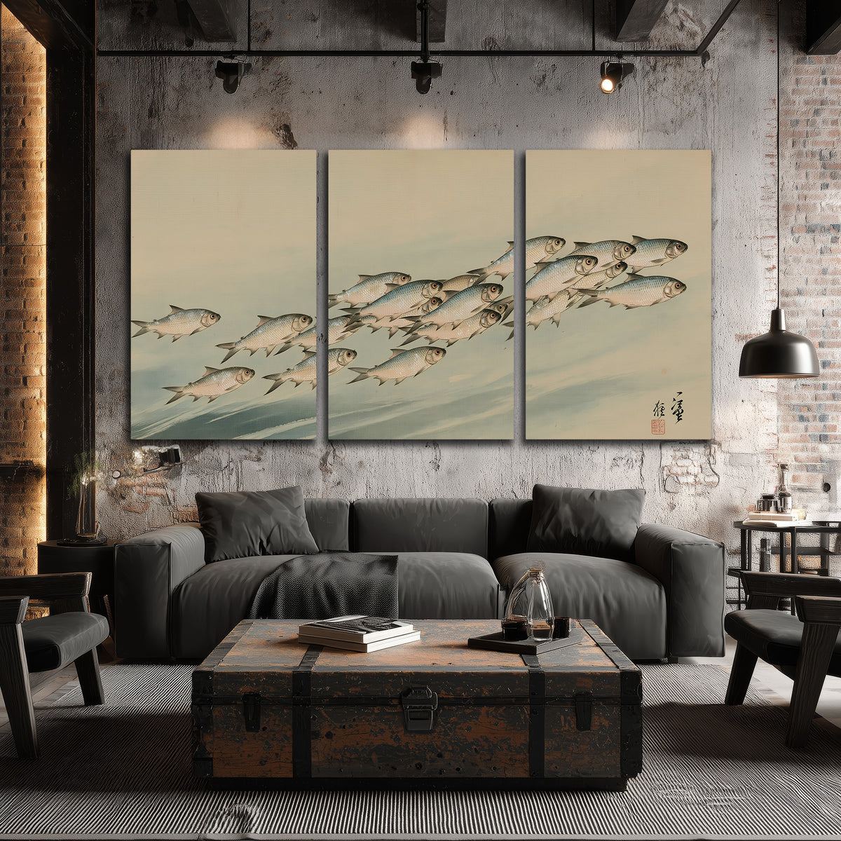 A flowing school of small fish above pale blue water on a cream ground 3 piece canvas wall art displayed in a industrial room