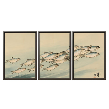 A flowing school of small fish above pale blue water on a cream ground 3 piece framed canvas wall art viewed straight on
