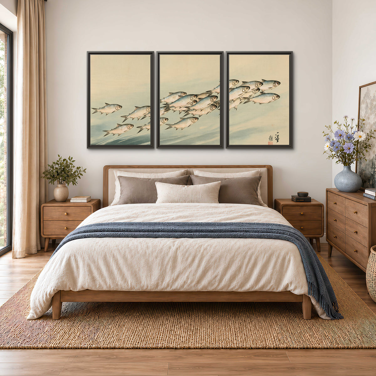 A flowing school of small fish above pale blue water on a cream ground 3 piece framed canvas wall art styled in an interior