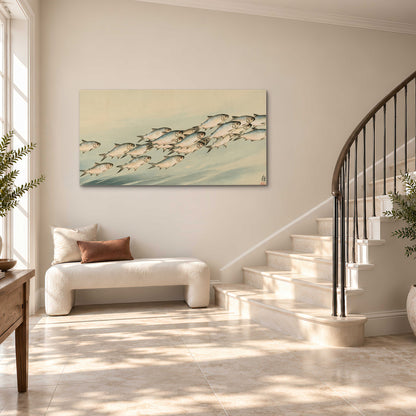 A flowing school of small fish above pale blue water on a cream ground single canvas wall art styled in an interior