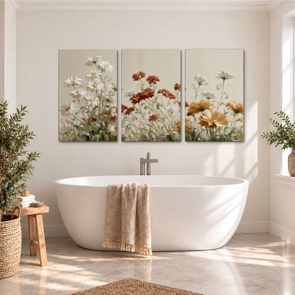 Loose ivory, rust and golden wildflowers on a soft neutral background 3 piece canvas wall art styled in an interior
