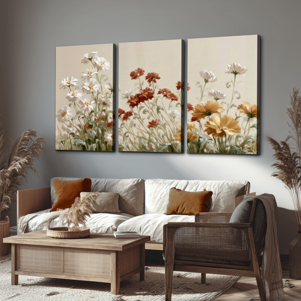 Loose ivory, rust and golden wildflowers on a soft neutral background 3 piece canvas wall art displayed in a rustic living room