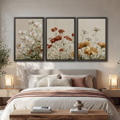 Loose ivory, rust and golden wildflowers on a soft neutral background 3 piece framed canvas wall art displayed in a bedroom