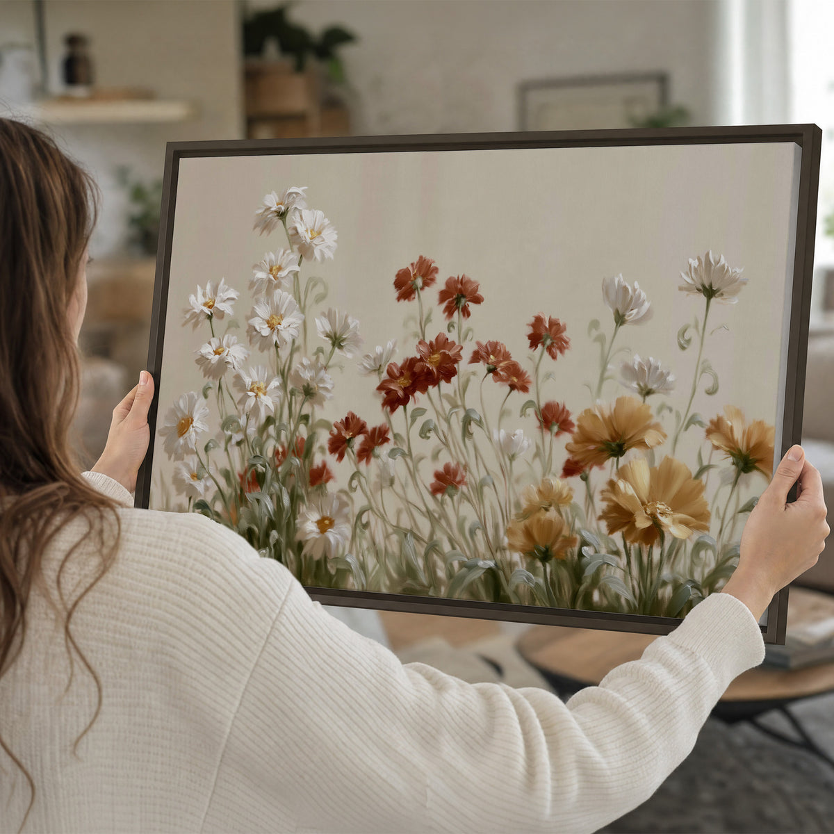 Loose ivory, rust and golden wildflowers on a soft neutral background single framed canvas wall art held in hands