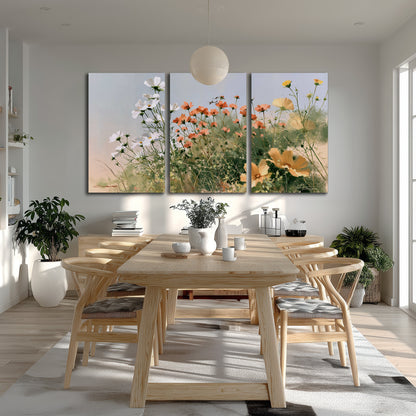 White and orange meadow flowers with fine green stems under a pale sky 3 piece canvas wall art room and product view