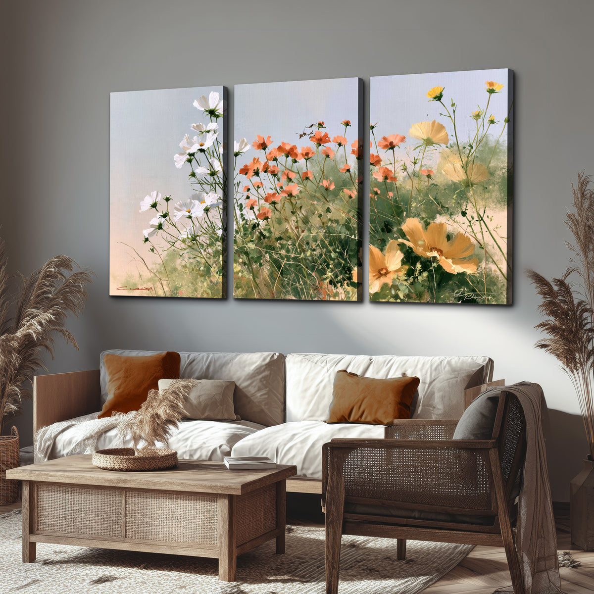 White and orange meadow flowers with fine green stems under a pale sky 3 piece canvas wall art displayed in a rustic living room