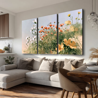 White and orange meadow flowers with fine green stems under a pale sky 3 piece canvas wall art room and product view