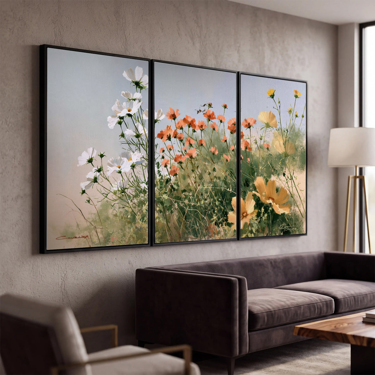 White and orange meadow flowers with fine green stems under a pale sky 3 piece framed canvas wall art displayed in a modern living room