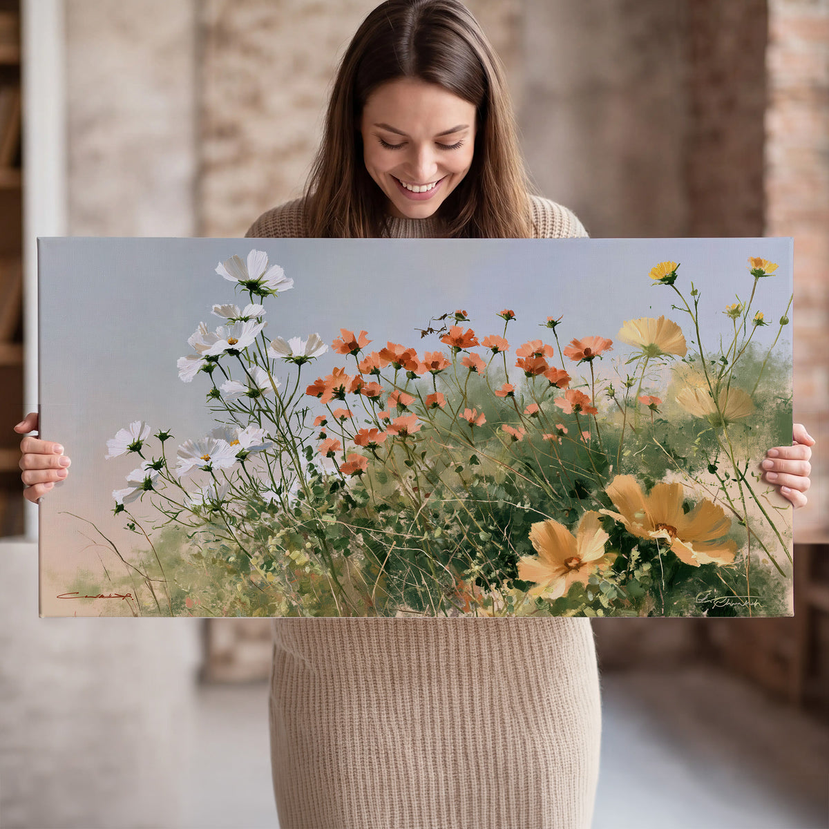 White and orange meadow flowers with fine green stems under a pale sky single canvas wall art held in hands