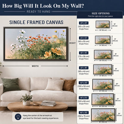 White and orange meadow flowers with fine green stems under a pale sky single framed canvas wall art size guide above a sofa; room view is illustrative