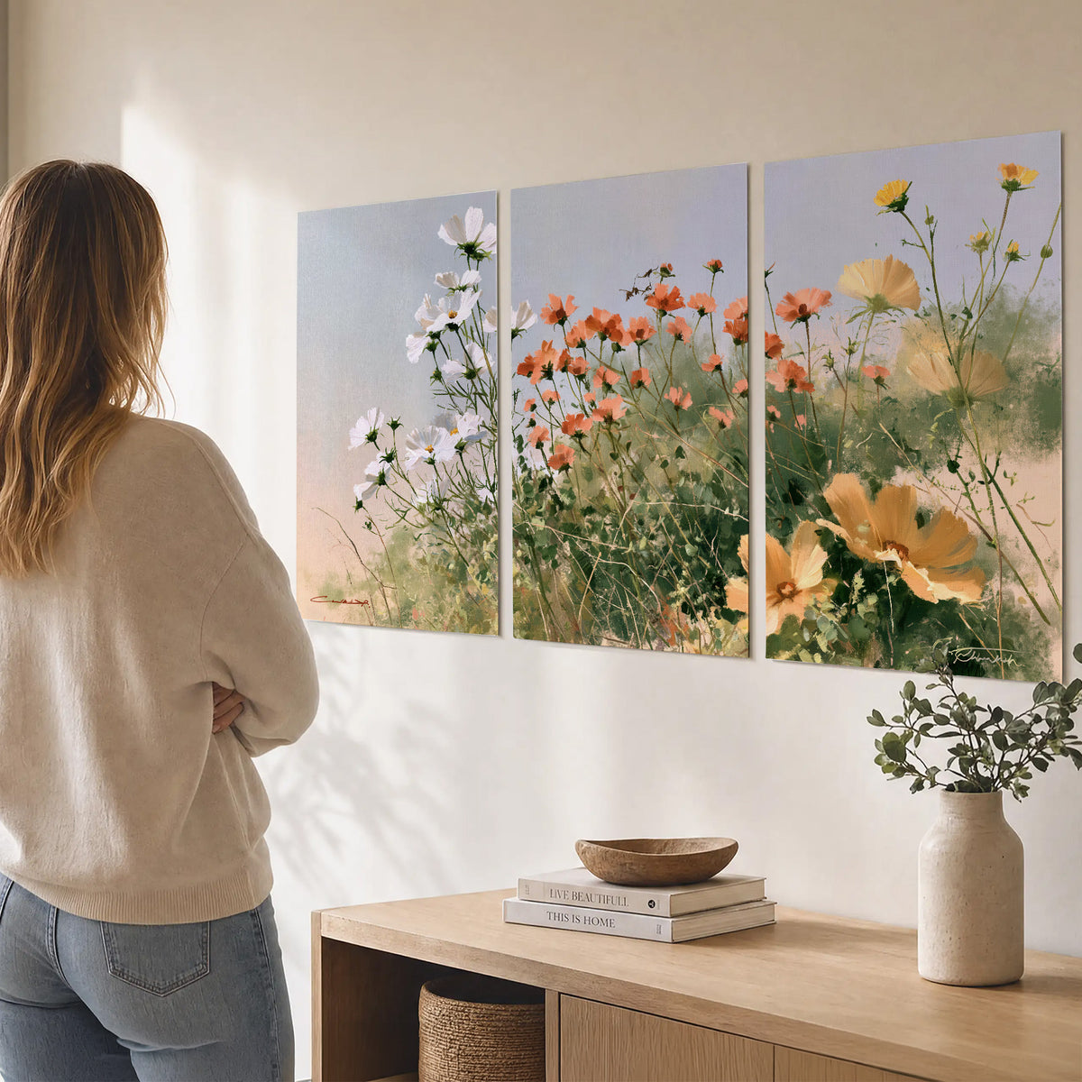 White and orange meadow flowers with fine green stems under a pale sky set of 3 poster prints three panel arrangement on a wall