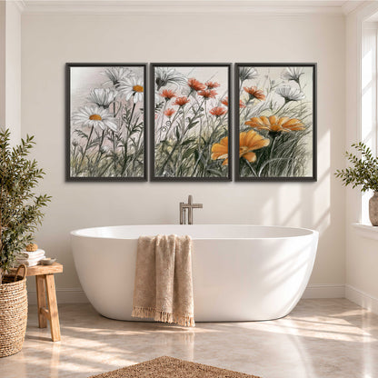 Fine dark stems and white daisies with warm orange accents in a delicate botanical composition 3 piece framed canvas wall art styled in an interior