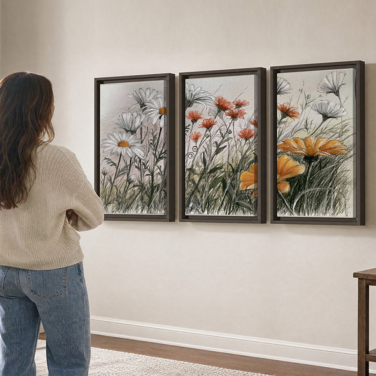 Fine dark stems and white daisies with warm orange accents in a delicate botanical composition 3 piece framed canvas wall art three panel arrangement on a wall