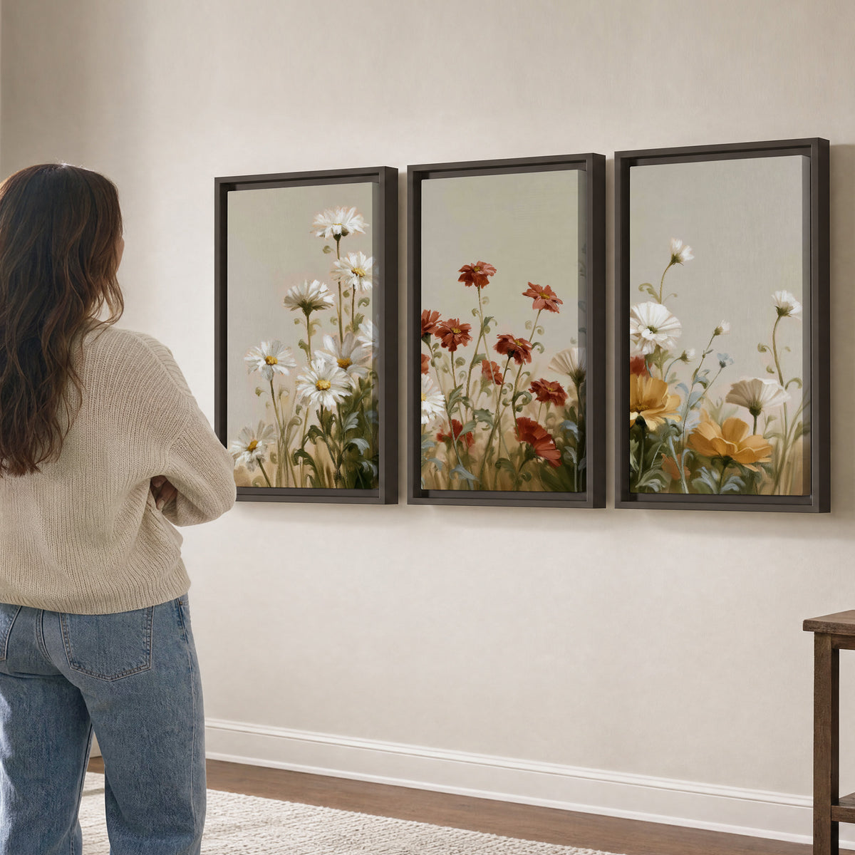 White wildflowers and warm red blossoms rising against a soft beige background 3 piece framed canvas wall art three panel arrangement on a wall