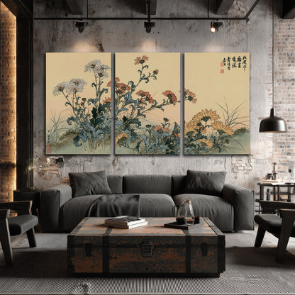 Flowering plants and a butterfly arranged on a warm cream ground with decorative script 3 piece canvas wall art displayed in a industrial room