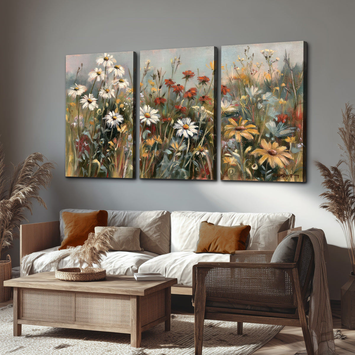 White daisies, rust blooms and long grasses in a softly shadowed meadow 3 piece canvas wall art displayed in a rustic living room