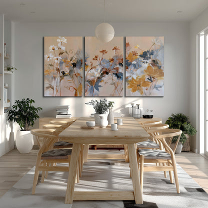 Loose blue and ochre blossoms layered across a warm neutral background 3 piece canvas wall art room and product view